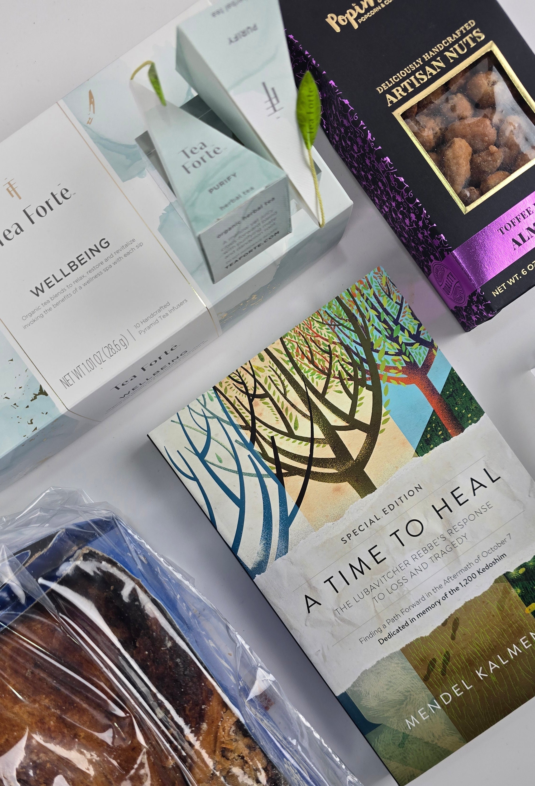 Luxury shiva and sympathy gift box with tea, chocolates, and elegant book from The POP BOX.