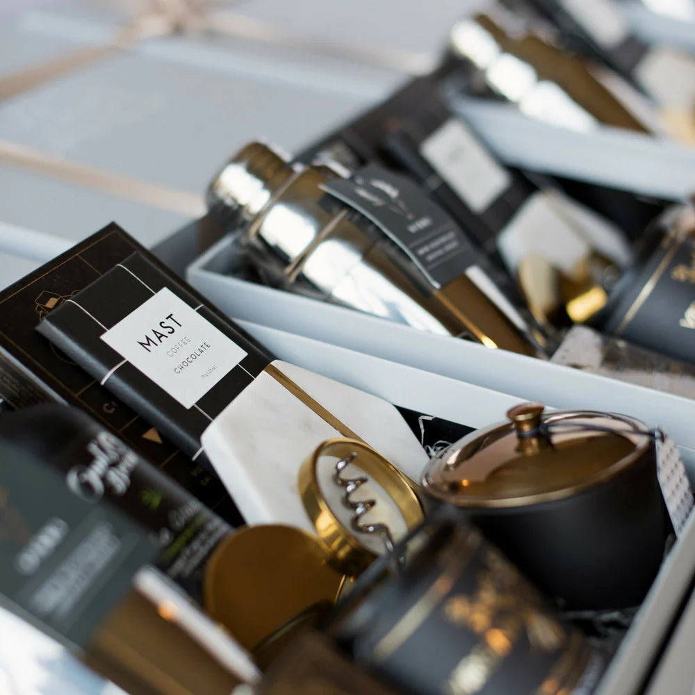 Custom luxury corporate gift boxes with black satin ribbon from The Pop Box