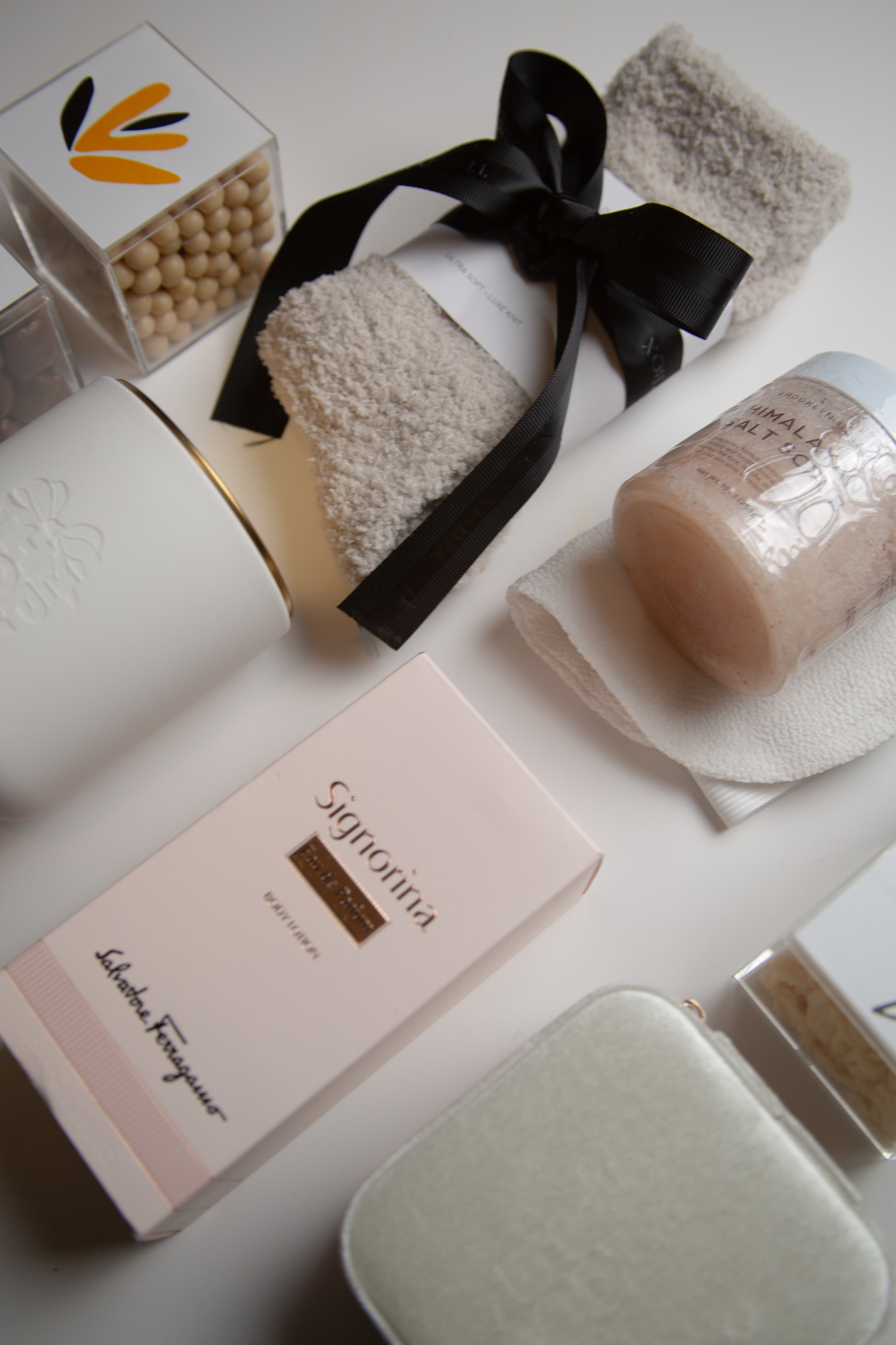 Luxury women’s gift box with candle, treats, and satin ribbon from The POP BOX